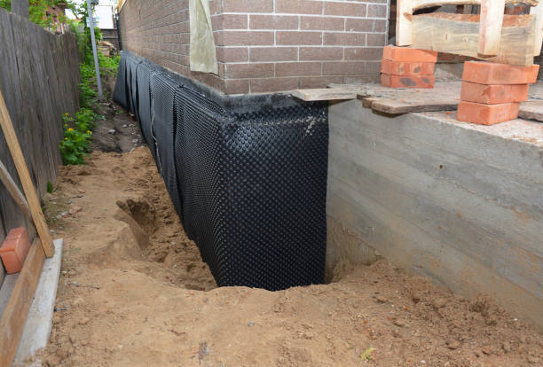 SJ Waterproofing Pros technician performing targeted Waterproofing assessment in Pittsford, MI